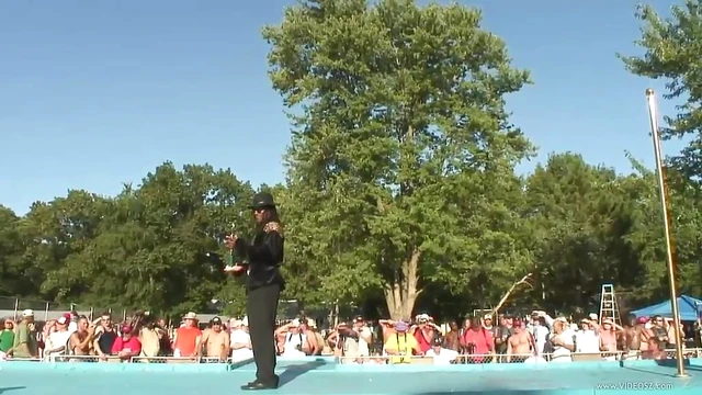 Naked Girls Pose Boldly Before Eager Crowd at Public Contest Event