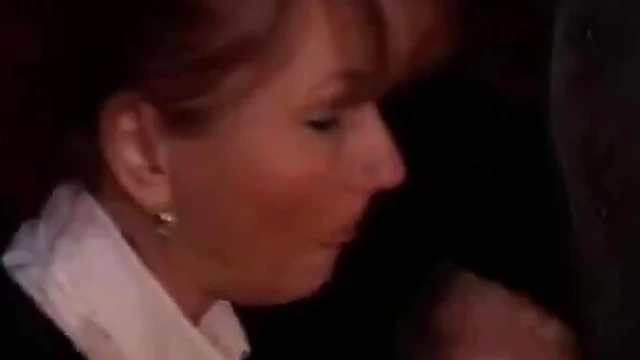 Passionate Blowjob Action Unfolds Inside Cozy Video Store Setting