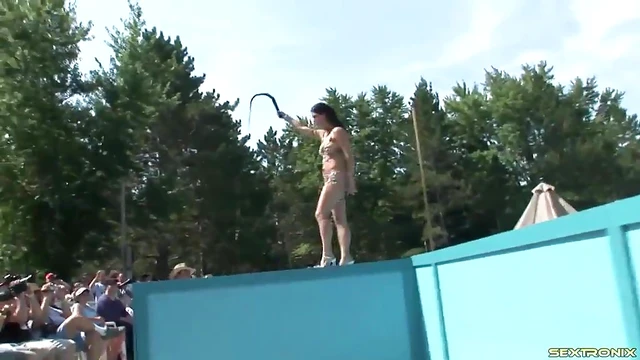 Sultry Tattooed Babe Dances Seductively Outdoors for Erotic Striptease Showdown