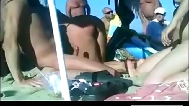 Hot Nudists Sunbathe Intimately While Enjoying Beachside Pleasure Time