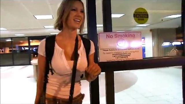 Sizzling Blonde Displays Stunning Tits at Busy Airport Lot