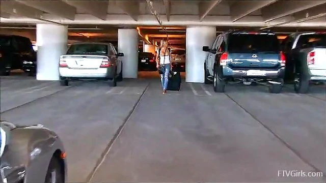 Sizzling Blonde Displays Stunning Tits at Busy Airport Lot