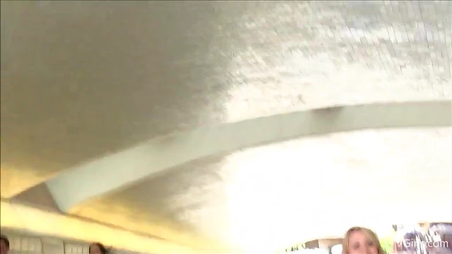 Sexy Blonde Shows Off Her Curves And Turns Heads In The Crowd