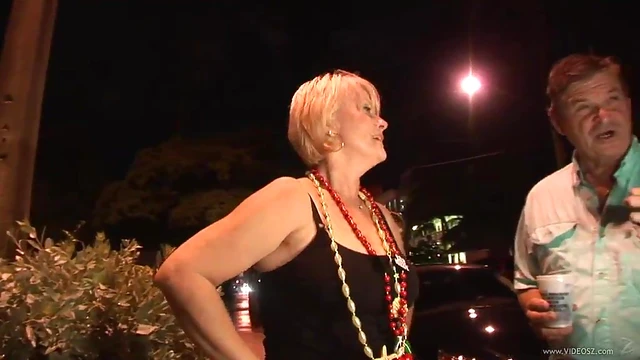 Seductive Cougar Shows Off Big Tits Under Mini-Skirt at Party