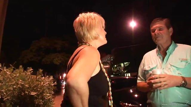 Seductive Cougar Shows Off Big Tits Under Mini-Skirt at Party