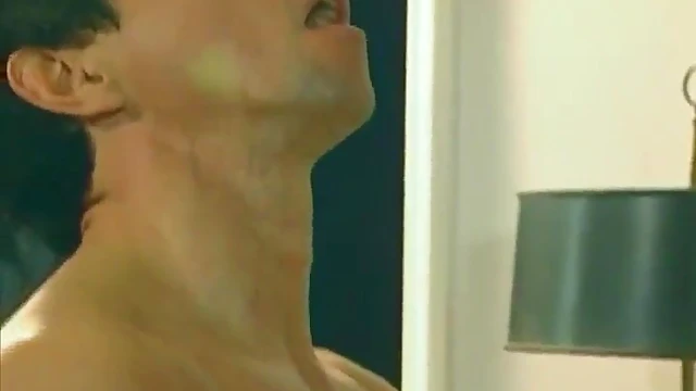 Seductive Brunette Enjoys Steamy Threesome Action in Bed